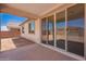 Enjoy outdoor living on this covered patio with sliding glass doors at 12326 W Marguerite Ave, Avondale, AZ 85323