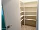Walk-in closet with ample shelving and carpet at 10509 W Tropicana Cir, Sun City, AZ 85351