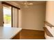 Open floor plan dining room with wood floors and sliding doors to the patio at 10509 W Tropicana Cir, Sun City, AZ 85351