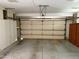 View of the garage showing the garage door and storage on the sides at 10509 W Tropicana Cir, Sun City, AZ 85351