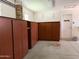Well organized garage with lots of built in storage cabinets at 10509 W Tropicana Cir, Sun City, AZ 85351