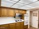 Kitchen with white countertops and a built-in microwave at 10509 W Tropicana Cir, Sun City, AZ 85351
