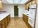 An open kitchen has lots of counter space and appliances, including oven and microwave at 10509 W Tropicana Cir, Sun City, AZ 85351