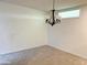 Carpeted Living Room with a chandelier and a window at 10509 W Tropicana Cir, Sun City, AZ 85351