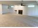Living room with a fireplace, fan and carpeted flooring at 10509 W Tropicana Cir, Sun City, AZ 85351