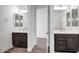 Double vanity bathroom with dark brown cabinets and mirrors at 5535 W St Moritz Ln, Glendale, AZ 85306