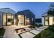 Beautiful backyard with water feature, desert landscaping, and modern architecture at 6850 E Joshua Tree Ln, Paradise Valley, AZ 85253