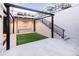 Contemporary patio with pergola, artificial turf, and stairs leading to an upper level at 6850 E Joshua Tree Ln, Paradise Valley, AZ 85253
