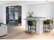 Modern bar area with counter seating, a wine cellar, and sleek finishes at 6850 E Joshua Tree Ln, Paradise Valley, AZ 85253