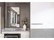 Elegant bathroom features a vanity with marble countertop and decorative vase at 6850 E Joshua Tree Ln, Paradise Valley, AZ 85253