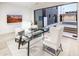 Bright office space with glass desk, comfortable seating, and views of the outdoor patio at 6850 E Joshua Tree Ln, Paradise Valley, AZ 85253
