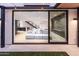 Indoor/outdoor living with sliding doors that seamlessly blend the living room and backyard at 6850 E Joshua Tree Ln, Paradise Valley, AZ 85253