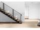 Modern staircase with wooden treads and black metal railing in a bright, open space at 6850 E Joshua Tree Ln, Paradise Valley, AZ 85253