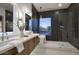 Sleek bathroom with double sinks, modern fixtures, and a luxurious walk-in shower and tub at 11566 E Christmas Cholla Dr, Scottsdale, AZ 85255