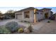 Charming home exterior with desert landscaping, complemented by a well-maintained walkway and stucco facade at 11566 E Christmas Cholla Dr, Scottsdale, AZ 85255