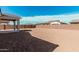 The backyard features a covered patio and block fence providing privacy at 12314 W Marguerite Ave, Avondale, AZ 85323
