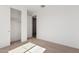 A bedroom featuring plush carpeting, with an open doorway and a closet with sliding doors, awaiting personalization at 12314 W Marguerite Ave, Avondale, AZ 85323
