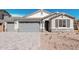 Lovely home with a two-car garage, brick-paved driveway, and appealing stone accents at 12314 W Marguerite Ave, Avondale, AZ 85323
