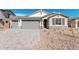 Charming single-story home with a three-car garage, stone accents, and low-maintenance landscaping at 12314 W Marguerite Ave, Avondale, AZ 85323