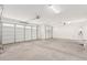 Spacious two car garage featuring epoxy flooring, bright lighting and a large space at 12314 W Marguerite Ave, Avondale, AZ 85323