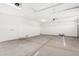 Spacious three-car garage featuring ample storage and a durable concrete floor, ideal for vehicles and projects at 12314 W Marguerite Ave, Avondale, AZ 85323