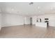 Bright, open floor plan combining living and kitchen areas with sleek tile floors and recessed lighting at 12314 W Marguerite Ave, Avondale, AZ 85323