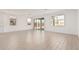 Bright, open-concept living room featuring tile flooring, large windows, and sliding door access at 12314 W Marguerite Ave, Avondale, AZ 85323