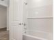 Bathroom featuring white subway tile, a tub, and a shower head at 12330 W Marguerite Ave, Avondale, AZ 85323