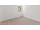 Spare bedroom with carpet, a window overlooking the side yard, and white walls at 12330 W Marguerite Ave, Avondale, AZ 85323