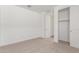 Spare bedroom with carpet flooring, white walls, and a closet at 12330 W Marguerite Ave, Avondale, AZ 85323
