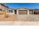 Well-maintained single-story home with a two-car garage and paved driveway in a sunny setting at 12330 W Marguerite Ave, Avondale, AZ 85323