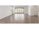 Spacious living room featuring sliding glass doors, neutral paint, recessed lighting and modern tile flooring at 12330 W Marguerite Ave, Avondale, AZ 85323