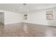 Bright open-concept living room features stylish tile flooring, recessed lighting, and neutral paint at 12330 W Marguerite Ave, Avondale, AZ 85323