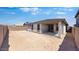 This backyard has a covered patio and is surrounded by a block fence at 25118 N 171St Ln, Surprise, AZ 85387