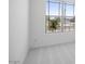 Bedroom with neutral carpet and a large window overlooking the neighborhood at 25118 N 171St Ln, Surprise, AZ 85387