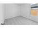 This bedroom features neutral carpet, white walls, and natural light from the window at 25118 N 171St Ln, Surprise, AZ 85387