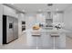 Bright kitchen with stainless steel appliances, spacious countertops, and a center island with bar seating at 25118 N 171St Ln, Surprise, AZ 85387