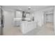 Well-lit kitchen featuring stainless steel appliances, ample cabinets, and a center island at 25118 N 171St Ln, Surprise, AZ 85387