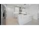 Modern kitchen features a large island, stainless steel appliances, and ample storage at 25118 N 171St Ln, Surprise, AZ 85387