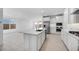 Spacious kitchen featuring an island, stainless appliances, and views into living spaces at 25118 N 171St Ln, Surprise, AZ 85387