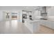 Bright kitchen featuring a large island, white cabinets, and stainless steel appliances at 25118 N 171St Ln, Surprise, AZ 85387