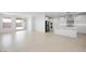 Open-concept floorplan with spacious living room open to the kitchen and access to the backyard at 25118 N 171St Ln, Surprise, AZ 85387