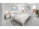 Serene bedroom featuring a plush bed, soft colors, and natural light from the windows at 25118 N 171St Ln, Surprise, AZ 85387