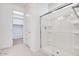 Bathroom featuring a glass-enclosed shower with white tile and chrome fixtures at 25206 N 172Nd Ln, Surprise, AZ 85387