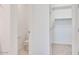 En suite bathroom featuring a toilet and walk-in closet at 25206 N 172Nd Ln, Surprise, AZ 85387