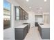 Modern kitchen featuring an island, stainless steel appliances, and stylish gray cabinetry at 25206 N 172Nd Ln, Surprise, AZ 85387