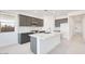 Modern kitchen featuring an island, stainless steel appliances, and stylish gray cabinetry at 25206 N 172Nd Ln, Surprise, AZ 85387