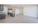A modern kitchen with gray cabinets, stainless steel appliances, and a white island with sink at 25206 N 172Nd Ln, Surprise, AZ 85387