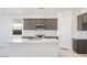 Modern kitchen featuring an island, stainless steel appliances, and stylish gray cabinetry at 25206 N 172Nd Ln, Surprise, AZ 85387