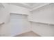 Spacious walk-in closet featuring ample shelving and rod space for organized storage at 25206 N 172Nd Ln, Surprise, AZ 85387